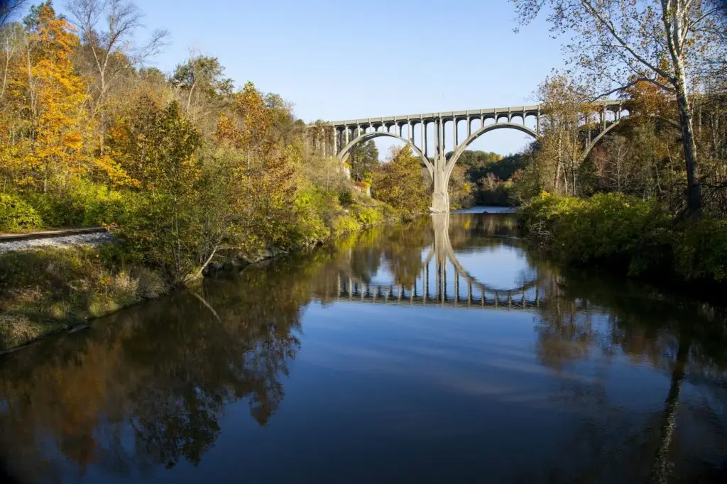Beautiful shot of a bridge reflecting in the Cuyahoga River in Ohio Hunting on a beautiful autumn day